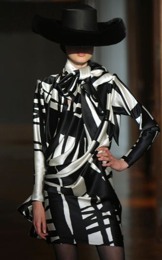 Illustration for article titled Christian Lacroix Couture Show A Blitz Of Somber Creativity For Dark Times